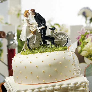 "A Kiss Above" Bicycle Bride And Groom Couple Figurine